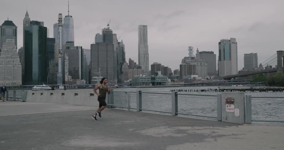 A man is jogging outdoors