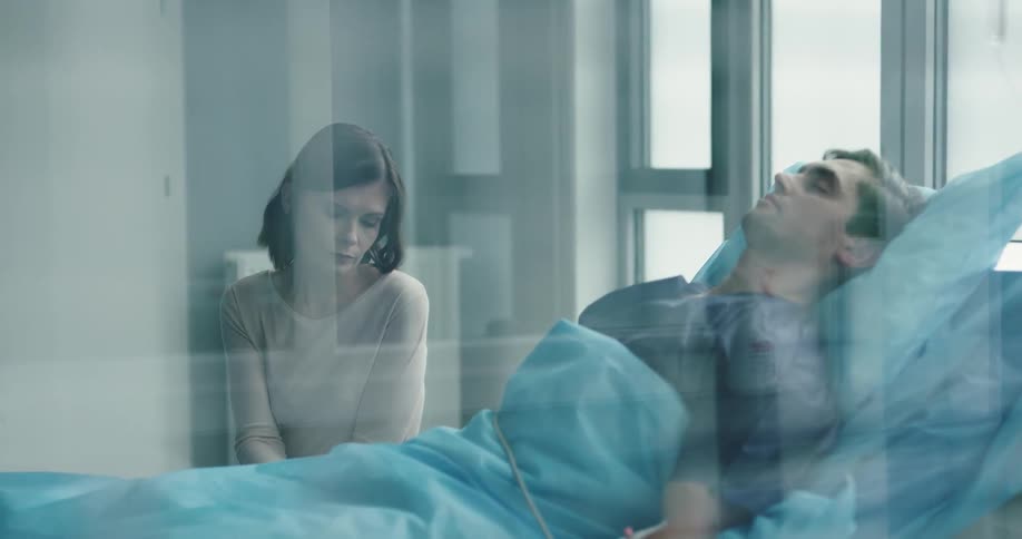 Woman waiting for her husband to wake up at the hospital