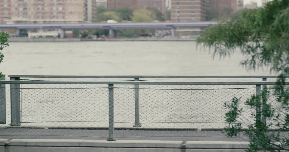 Girl running next to a river