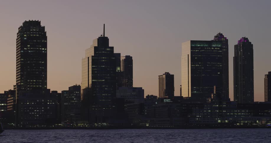 Waves are moving in the ocean by the city skyline