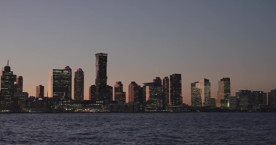 Waterfront city skyline at sunset