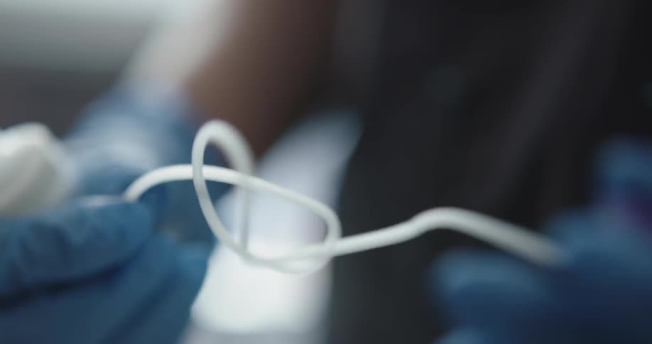 A doctor preparing for an infusion