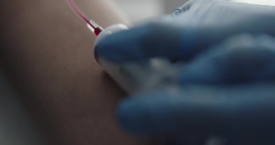 Medical person draws blood