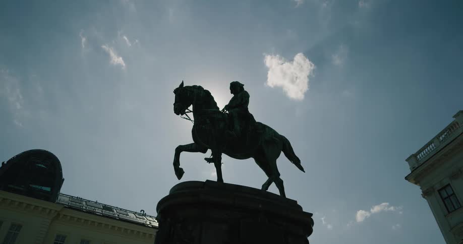 The clouds move over the statue