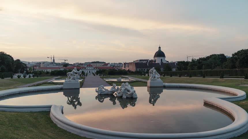 A view of a city and a public park at dawn