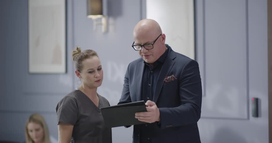 A man is explaining something to a doctor