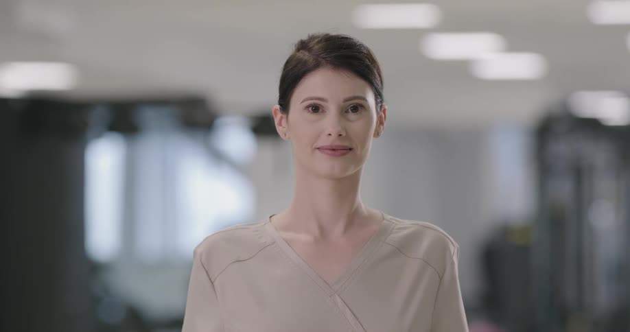 A womansmiles into the camera