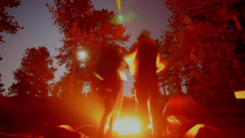 A time lapse of people in a camp fire