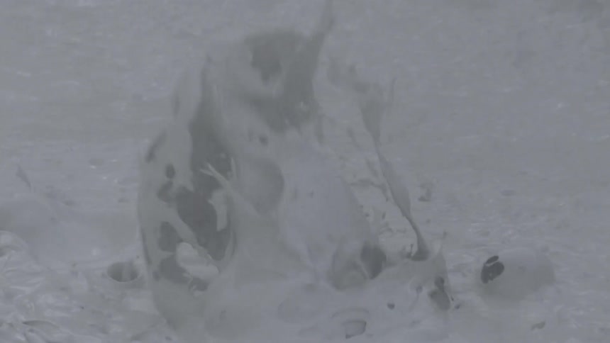 Thick white liquid bubbling and splashing