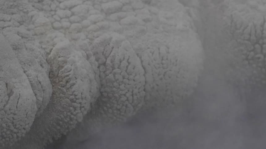 Steam rises next to the white fabric