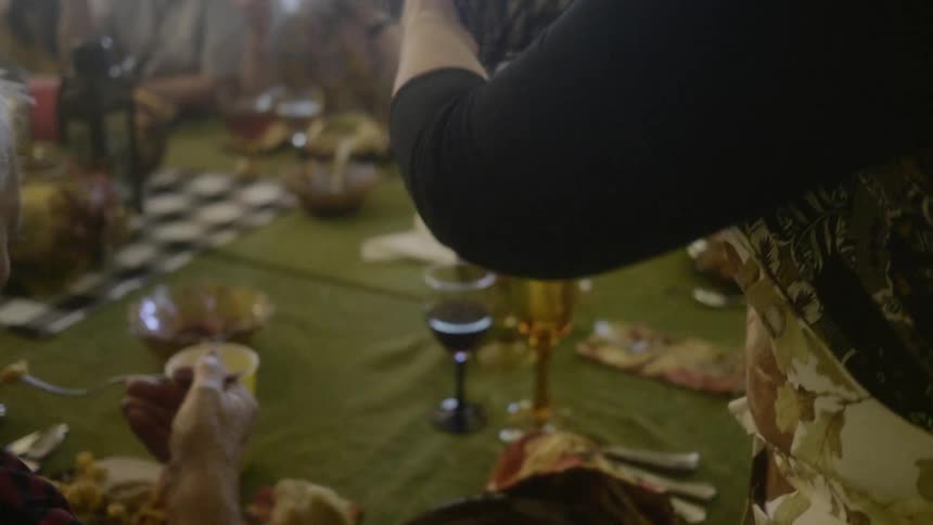 Mother serving cake to the table