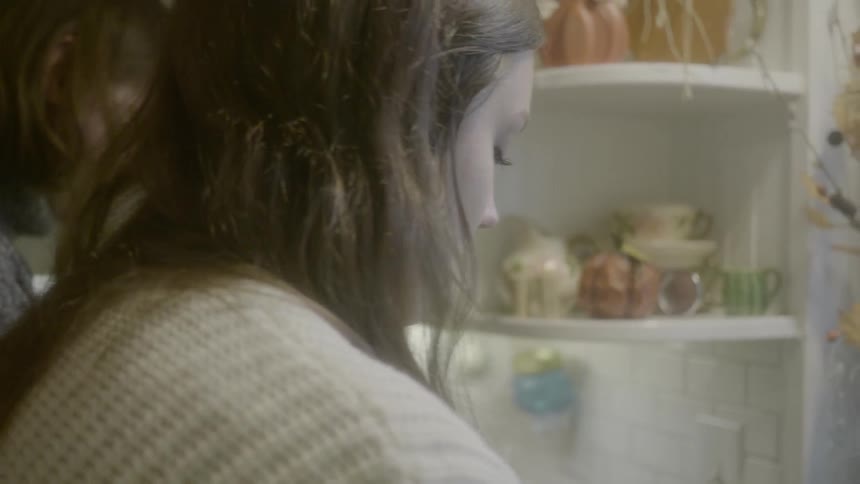 Women work at kitchen counter
