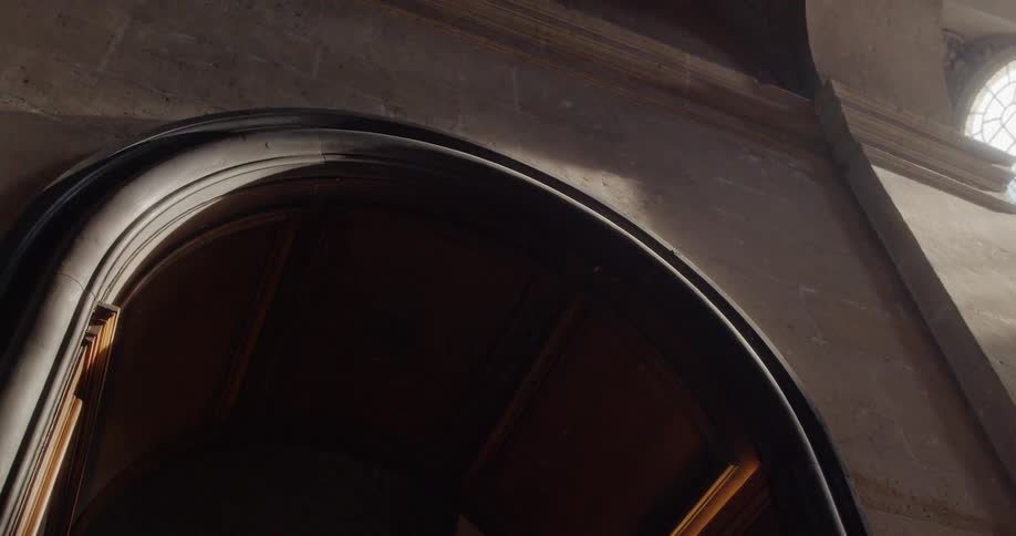 A view of an entrance gate of a classical building
