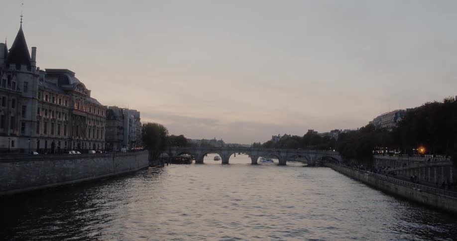 A scenery of a bridge on the river at dawn