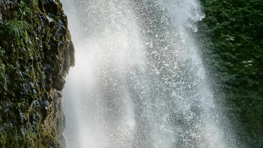 A waterfall pours down