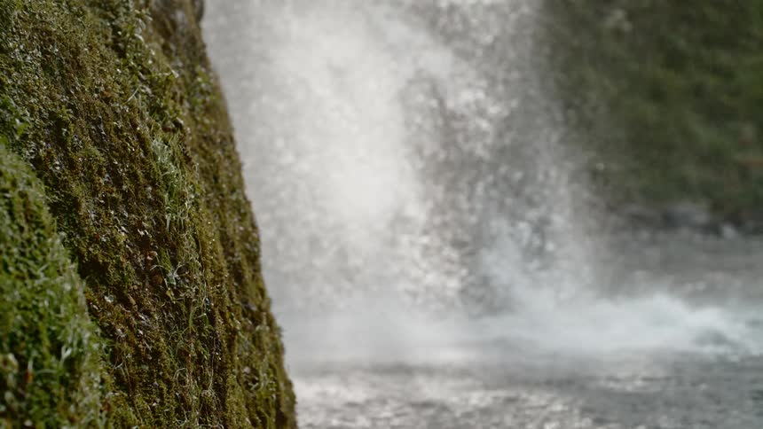 Water falls into the river below
