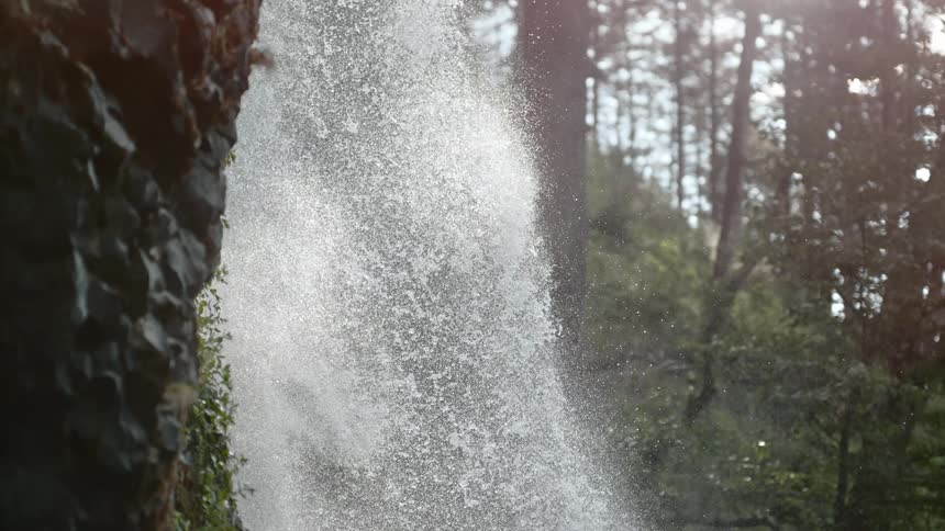 A waterfall rushing over the edge of a cliff