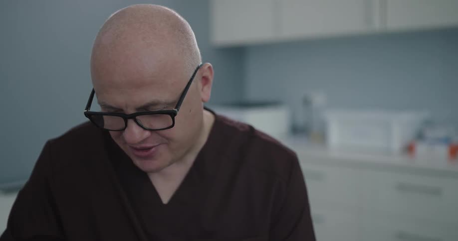A portrait of a doctor with glasses