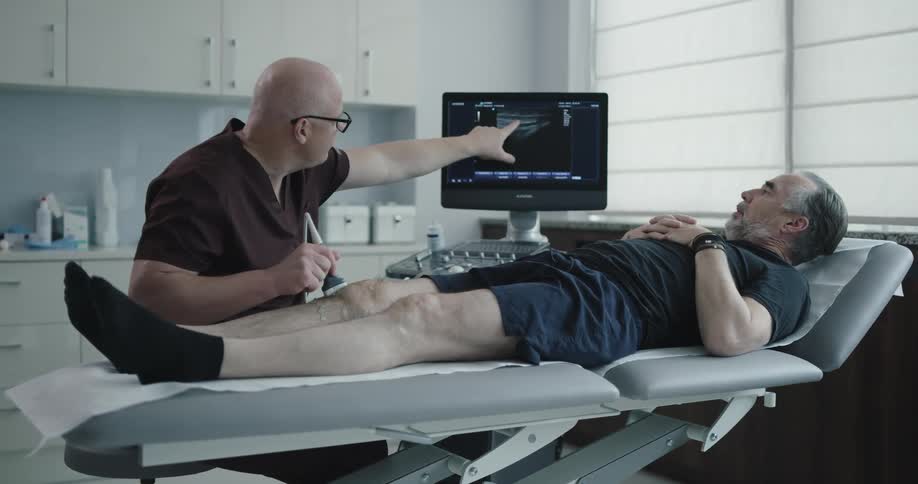 A doctor works with a patient