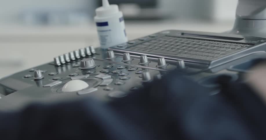 Man operating a high tech device