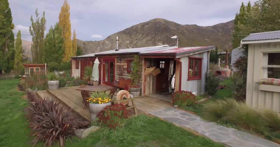 View of two tiny cottages out in the country