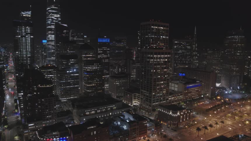 Skyline of the illuminated city with tall buildings and skyscrapers at night