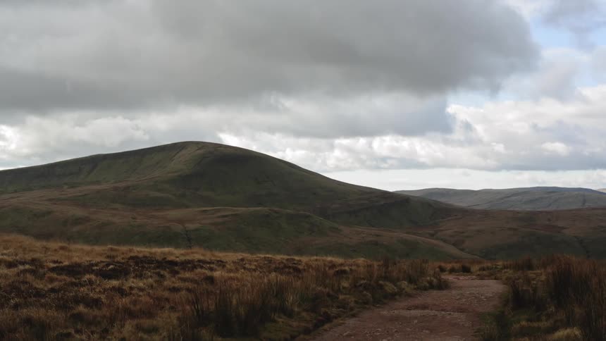 A scenery of a hill and mountain