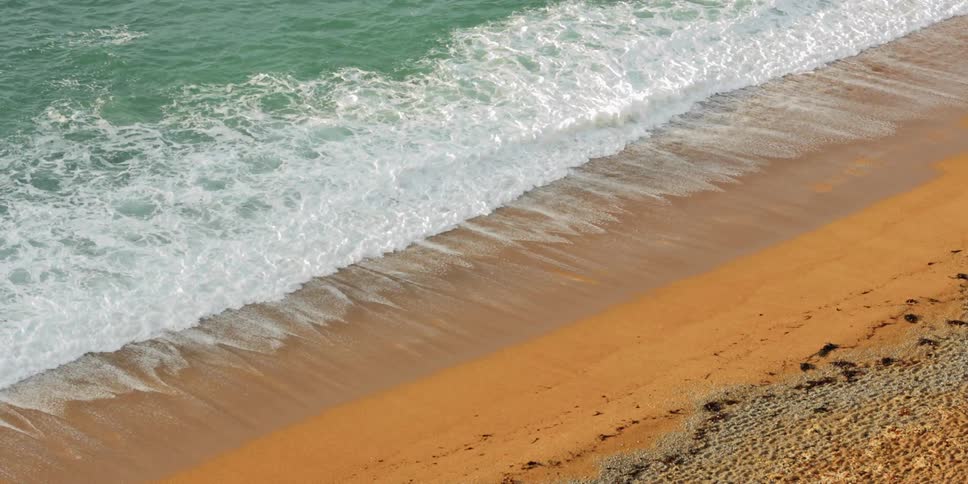 Waves are moving towards the beach coast