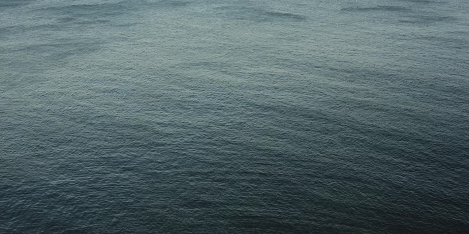 Gentle waves roll on the surface of the ocean