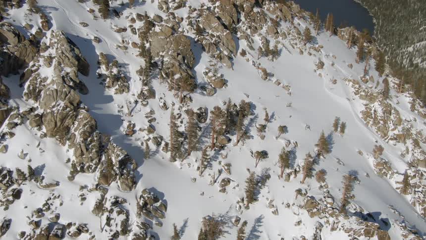 The summit of a rocky and snowy mountain