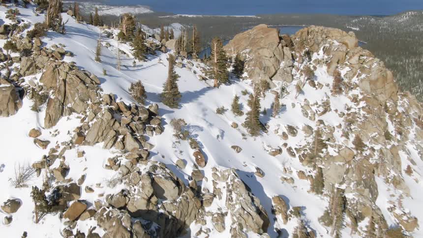 Birds eye view of a person skiing down a large rocky hill
