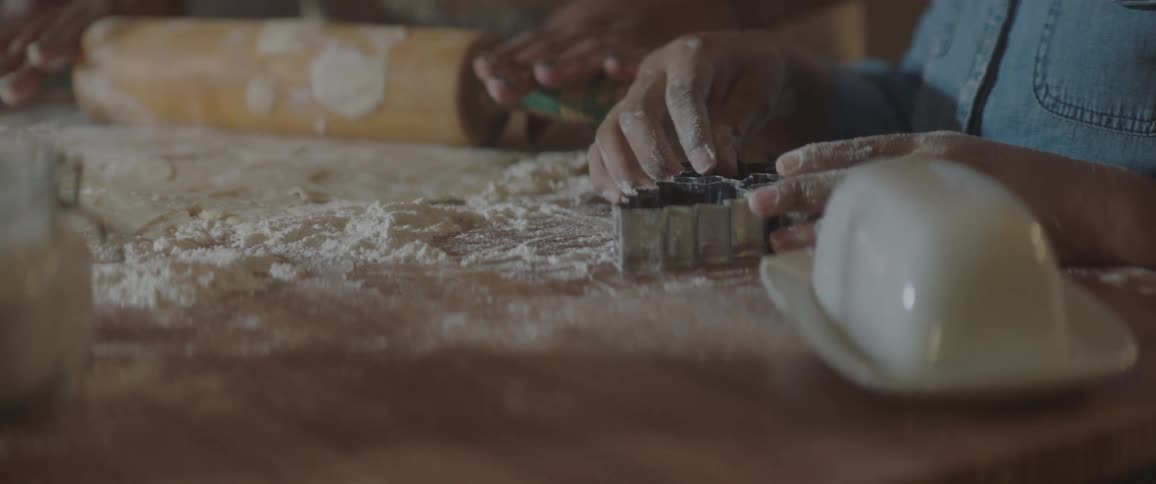 Girl playing with metal cookie mold