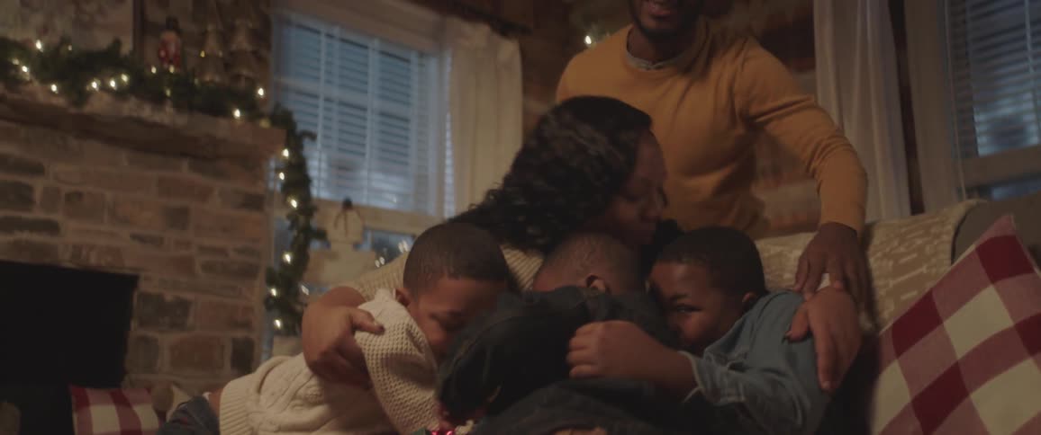 Father and mother hug all of his family at the christmas day