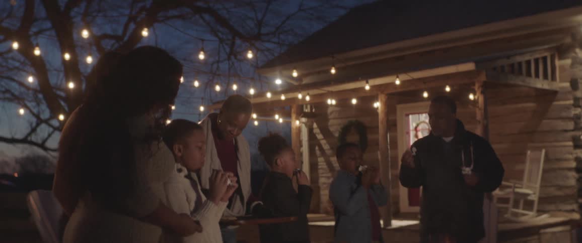 A family party at the garden on the winter night