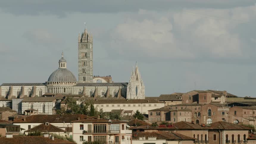 A city with a large tower in the background