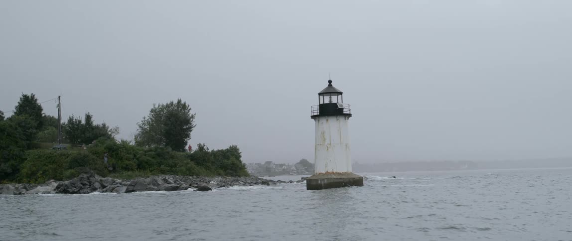 A light house just off the shoreline
