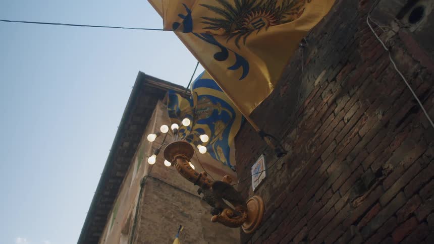 A yellow flag flattering at the wall