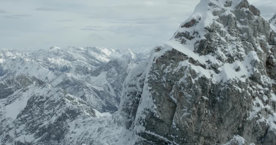 Mountain peaks are dusted with a light layer of snow