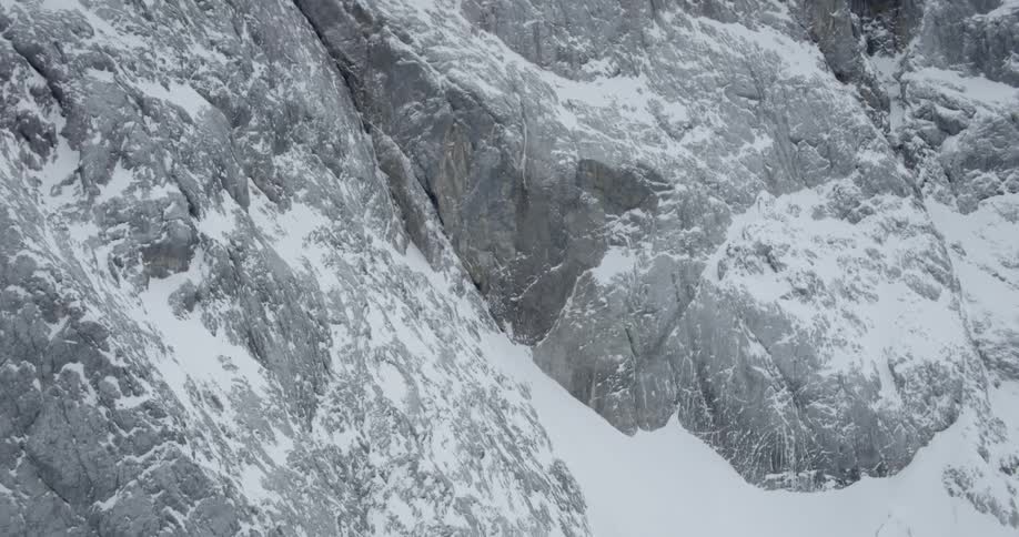 A snowy cliff at daytime