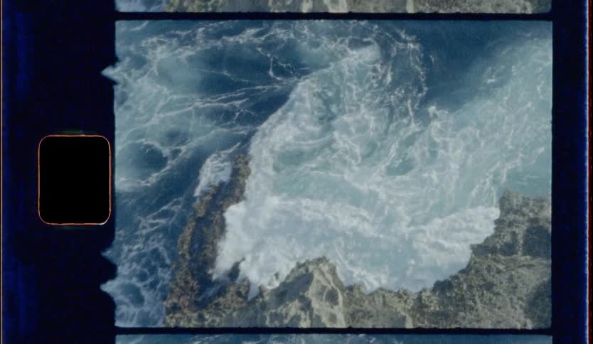 Birds eye view of footage of water rushing to the shore