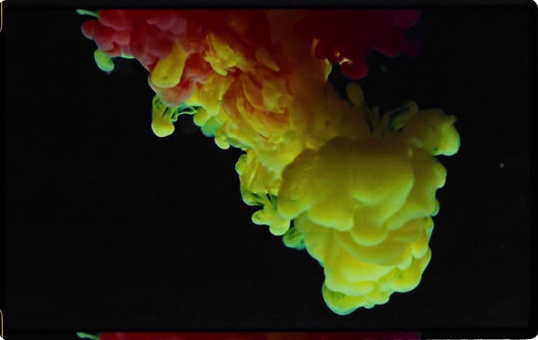 Bursts of color floating in water