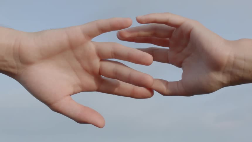 A woman is touching her fingers together