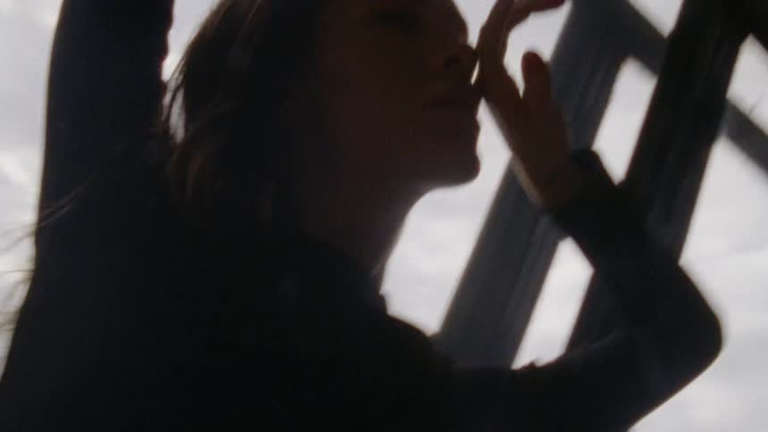 A woman poses with perfume