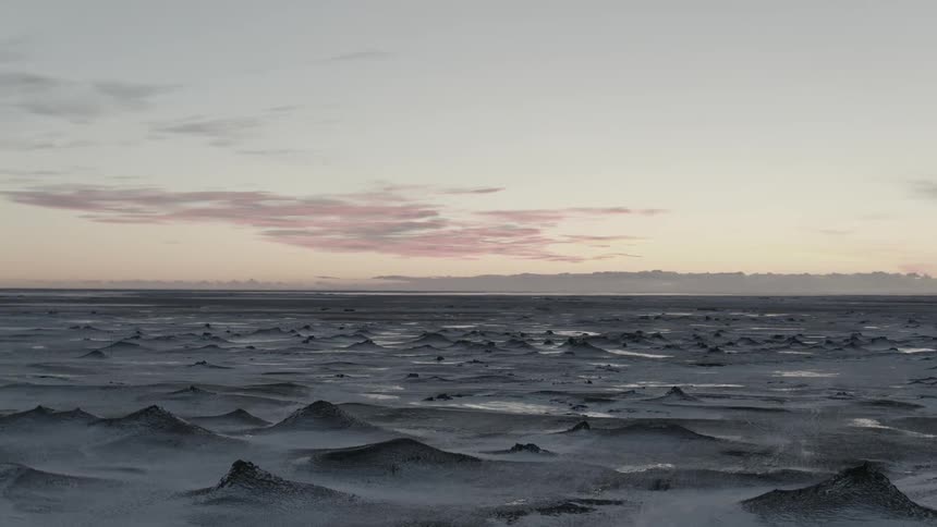 Water is frozen in numerous peaks on top of the ocean