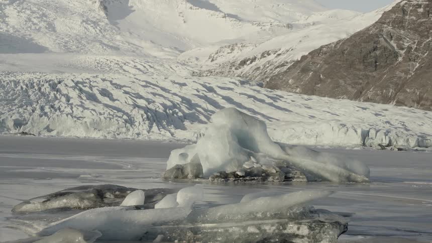Rocks covered in ice on a frozen body of water