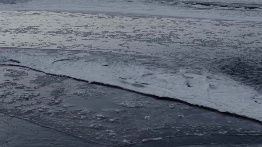 A scenery of an icy river