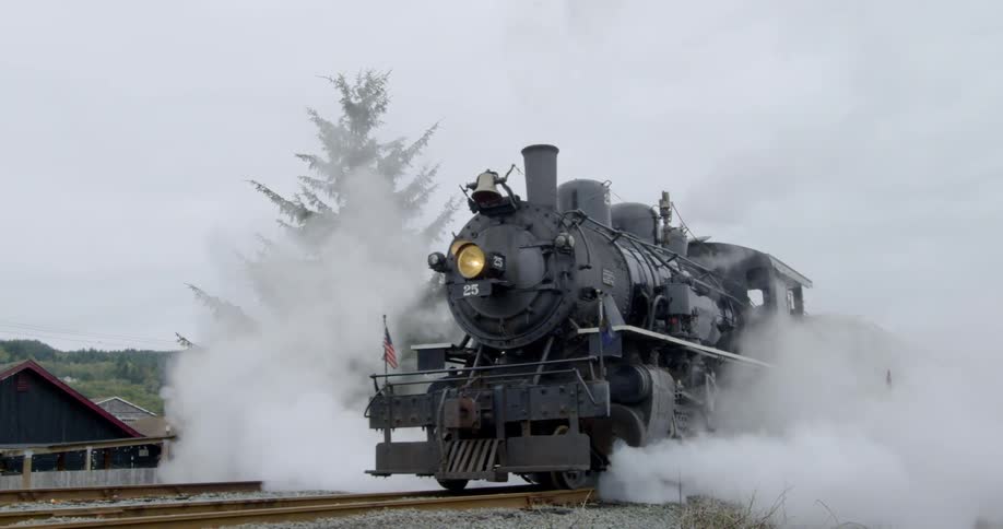 A steam train blowing smoke