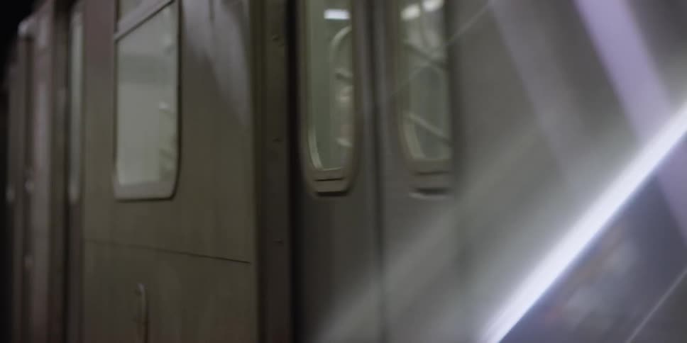 A subway train drives by