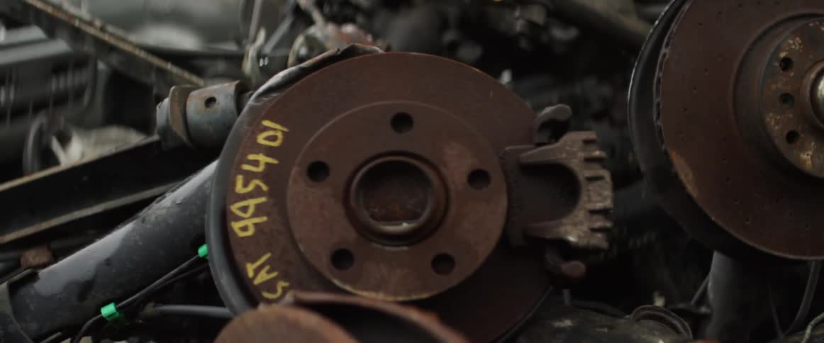 Inside of a car engine has a number written on one part