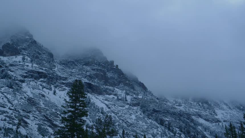 Clouds blowing over a mountain top